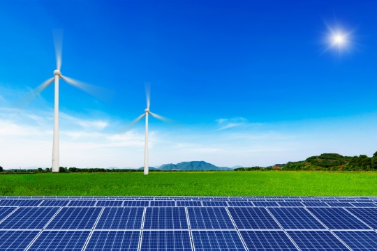 solar-panels-and-wind-generators-under-blue-sky-on-sunset 540x360